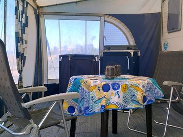 Spacious awning with extra 2-burner gas stove and extra storage space