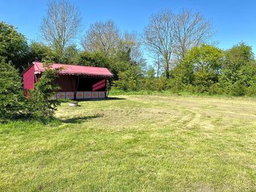Premier pitch with private kitchen, private kitchen, toilet and shower amenities