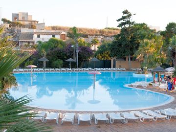 Sun loungers next to the pool