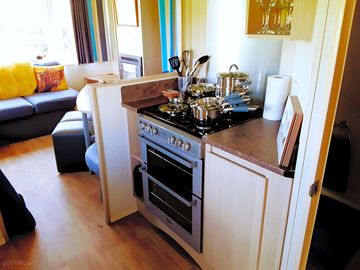 Fully equipped kitchen with pots , pans etc . gas hob, grill & oven. microwave & fridge/freezer