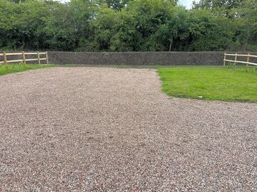 Neat gravel hardstanding and grass pitch