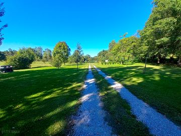 Green tree-lined pitches