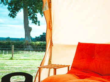 Futon and view from bell tents. photo taken by boutique camping.