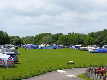 Pitches around the edge of the grass field