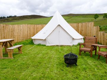 Bell tent surrounded by fencing