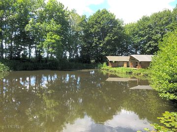 Safari tents nearby the water