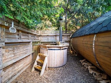 The wood-fired hut tub is very popular in the Owl pods.