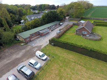 Drone shot of the café, washrooms, parking and check-in point