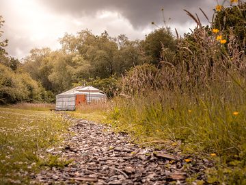 The yurt is private and peaceful, tucked away in its own meadow