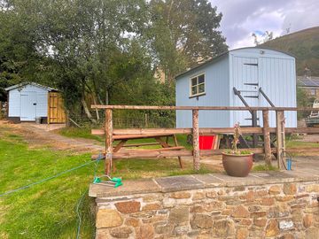 Shepherd's hut with facilities shed