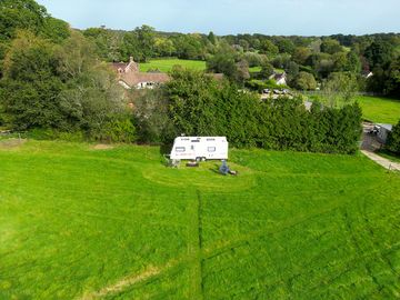 Drone shot of the Touring Caravan in our field.