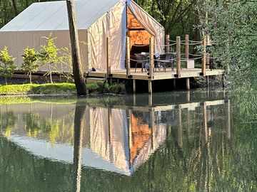 Glamping tent across the lake