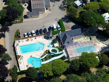 Aerial view of the site and pools