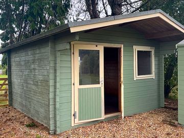 A summerhouse fitted out with running water, electricity and fridge is available for your use