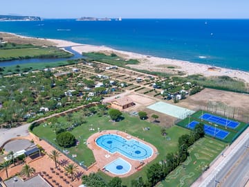 Aerial view over the site and beach