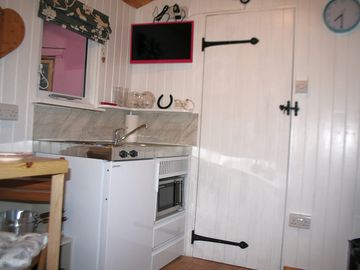 Kitchenette next to the door to the shower room
