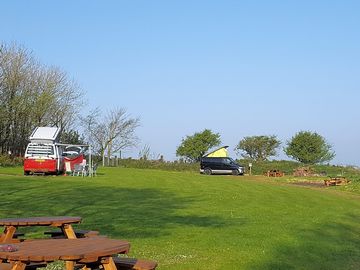 Grassy campervan pitches with sea views