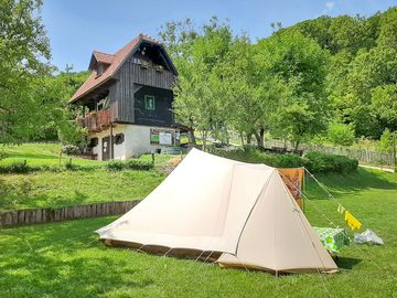 Grassy pitches next to traditional houses