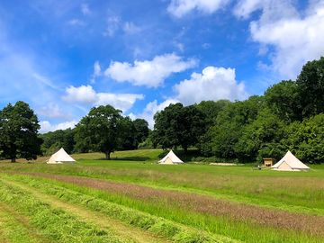 Bell tents pitched well away from each other for privacy