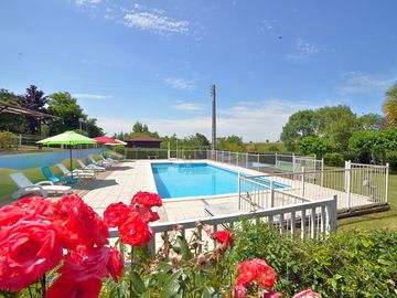 The swimming pool with sun terrace