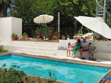 Outdoor swimming pool with seating areas