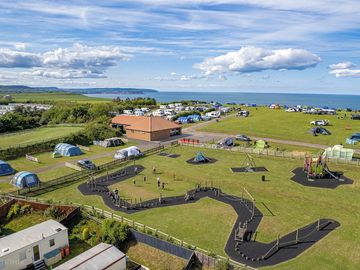 Childrens Play Area with camping field and upper touring caravan area in the background.