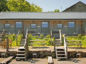 View of stable cabins lapwing, linnet and skylark