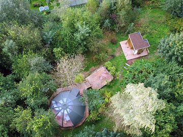 Aerial view of the dome in the middle of woodland