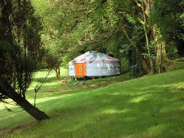View of the yurt through the trees