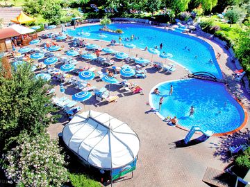 View over the swimming pool, paddling pool and sun terrace