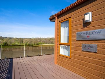 Large outside decking area with Lovely views across the rolling hills of wales