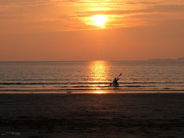 Kayaking at one of the stunning local beaches not far from tretio