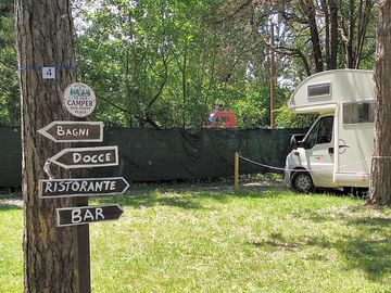Signpost showing campsite facilities
