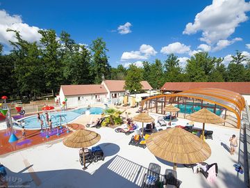 Swimming pool - covered and heated with water play area and waterslides