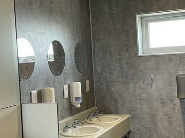 Wash hand basins in male bathroom