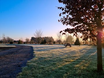 Sunrise over the grass pitches