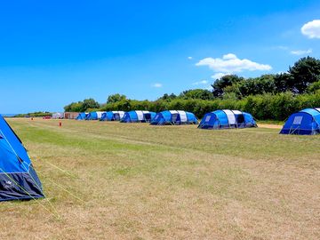 Our pre-erected tents give you space to park, bbq, kids to play and have a campfire