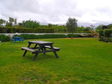 two power sites, by blue table. Trampoline