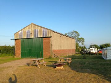 The barn has three ping pong tables and a table football to keep the kids entertained
