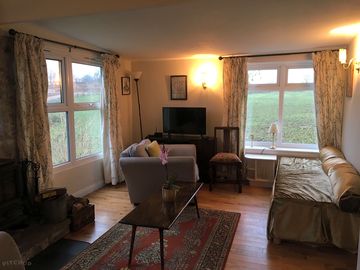 Living room showing one of the divan beds