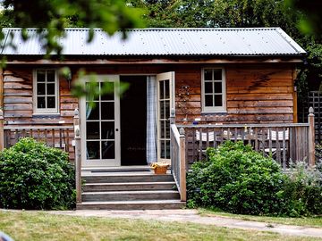 The ‘living’ hut, with a kitchen area, a shower room and a lounge space with squishy sofa