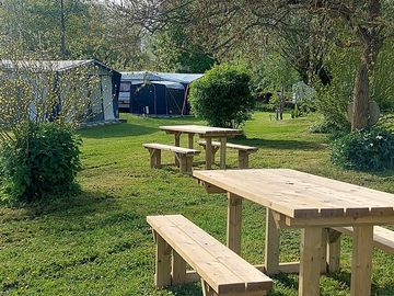Picnic tables on the grass pitches