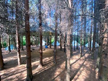 Communal fire area for pre-erected tipi tents