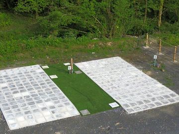 Slabbed pitches with grass surround