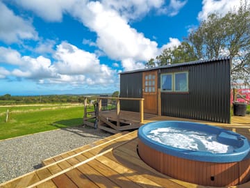 Decking surround with hot tub and gorgeous views.