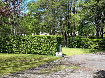 Grass pitches surrounded by hedges