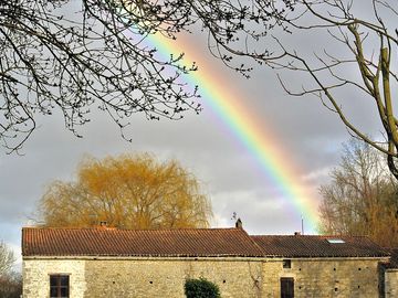 Rainbow over the watermill
