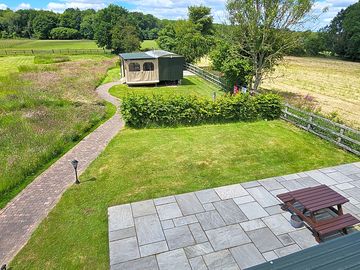 View from lazy days tiny home towards keeper's cosy tiny home and non-electric pitches 14 to 15