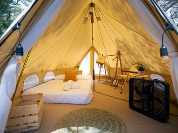 Bell tent with storage, cooler and seating