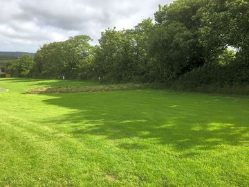 Sheltered by trees on one side and facing west, this pitch has the best views of the setting sun